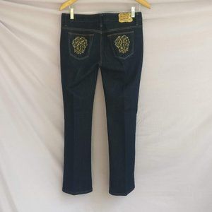 Embellished Shiny low rise flared Darkwash Blue jeans with measurements worn 2x